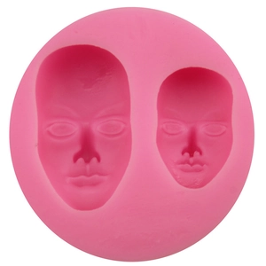 Pink silicone mold featuring detailed male and female face shapes for DIY fondant and crafts