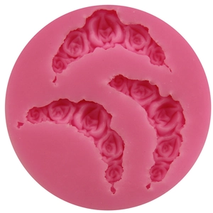 Pink silicone mold featuring three detailed rose flower designs for DIY fondant and chocolate
