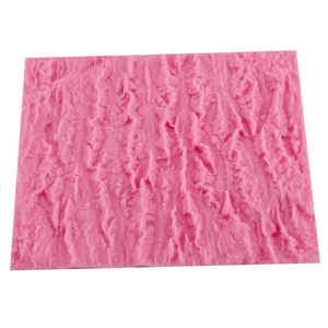 Pink silicone fondant mold with detailed tree bark texture for professional cake decoration