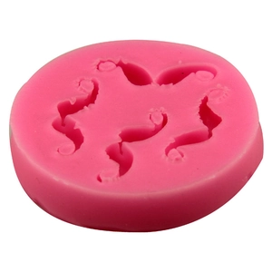 Pink silicone mold featuring four seahorse shapes for chocolate, soap, and fondant cake DIY