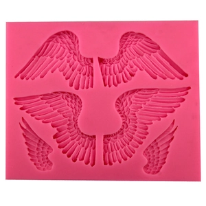 Pink silicone mold featuring three pairs of detailed angel wings for fondant and DIY crafts