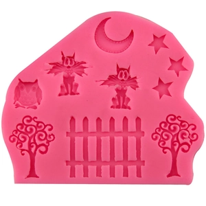 Pink silicone mold with moon star owl and fence patterns for cake and fondant baking