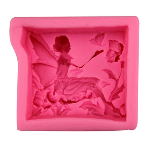 Pink silicone mold featuring a sitting angel with butterfly and flowers for DIY soap crafts