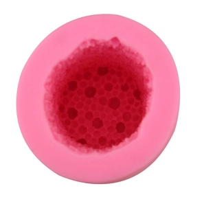 Pink round silicone mold for handmade soap with detailed honeycomb textured surface