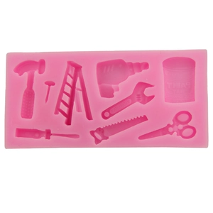 Pink silicone mold featuring eight hardware tool shapes for DIY fondant and clay crafts