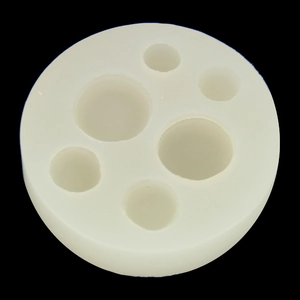 3D round silicone mold for macaron and biscuit DIY crafts on black background