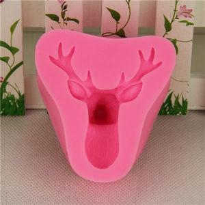 Detail view of pink silicone deer head mold showing intricate antler textures and flexible material