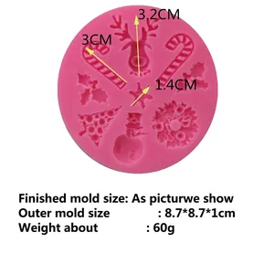 Pink silicone mold featuring Christmas motifs like reindeer, tree, and snowflakes for DIY cakes