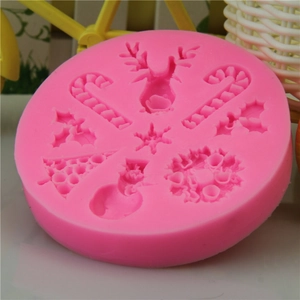 Pink silicone Christmas cake mold with reindeer, snowflake and tree relief patterns