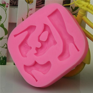 Pink silicone mold featuring four high-heeled shoe styles for fondant and chocolate DIY