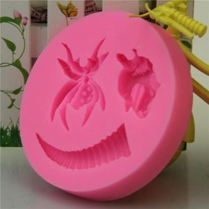Pink silicone mold for Halloween soap or fondant with spider, insect, and horn designs