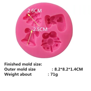 Pink silicone mold with Christmas bell and wreath shapes for fondant and DIY crafts