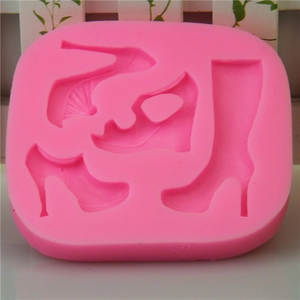 Pink silicone fondant mold featuring four distinct high heel and boot styles for cake DIY