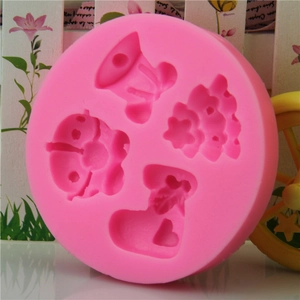 Pink silicone mold with Christmas tree sock and bell shapes for DIY fondant cakes