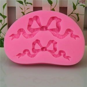 Moule en silicone rose avec nœud pour décoration de gâteaux et chocolats de mariage