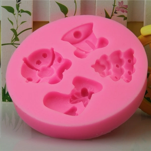 Pink Christmas silicone mold featuring bell, tree, sock, and bear shapes for DIY baking
