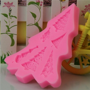 Pink silicone mold featuring 6 assorted Christmas cedar tree shapes for fondant and baking