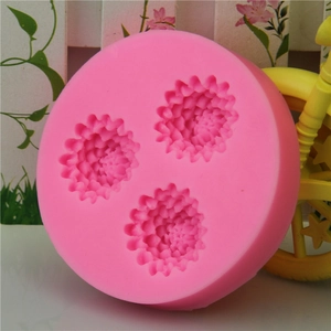 Pink silicone mold featuring three intricate pinecone flower shapes for DIY cake decorating