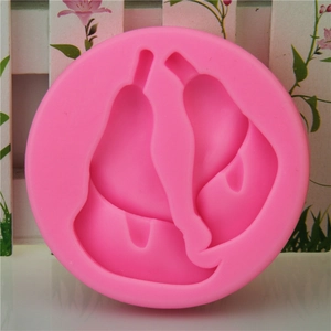 Pink silicone fondant mold featuring detailed pear and fruit slice shapes for DIY baking