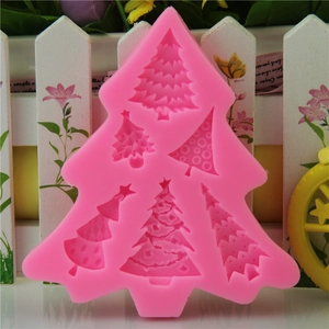 Pink silicone mold featuring 6 assorted Christmas tree designs for baking and crafts