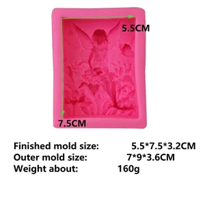 Pink silicone angel mold for fondant and chocolate cake with detailed flower fairy relief
