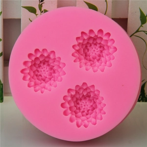 Pink silicone mold featuring three detailed pinecone flower shapes for cake decorating and DIY