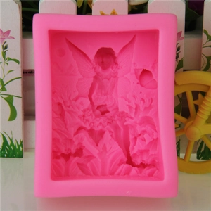 Pink silicone mold featuring detailed angel on flower design for soaps and fondant cakes