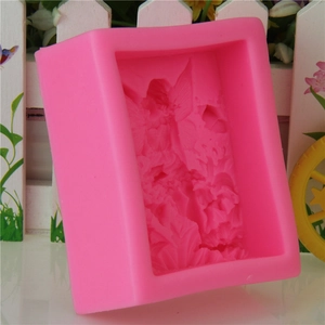 Pink silicone mold featuring an angel girl on a flower for soap and fondant making