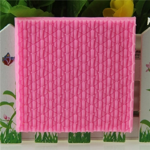 Pink silicone fondant mold with geometric diamond texture for cake decorating