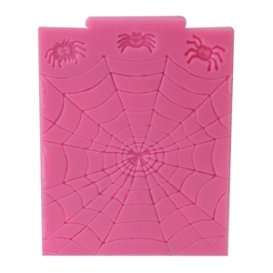 Pink silicone fondant mold featuring detailed spider web and 3D spider relief patterns