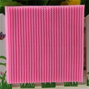 Pink silicone fondant mold featuring dense knitted sweater textures for cake decoration