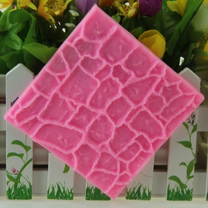 Pink silicone mold with antique stone wall texture for fondant and clay crafting