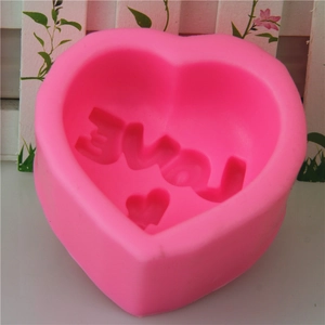 Pink heart-shaped silicone mold with LOVE engraving for DIY chocolate and soap making