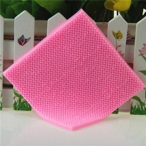 Pink silicone fondant mat with detailed knitted sweater texture for cake decorating