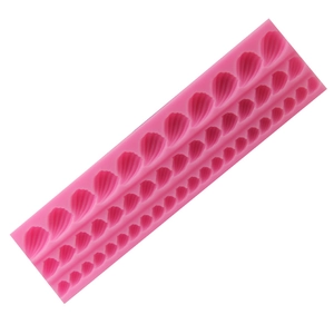 Pink silicone shell fondant mold with three rows of different sizes for DIY cake decorating
