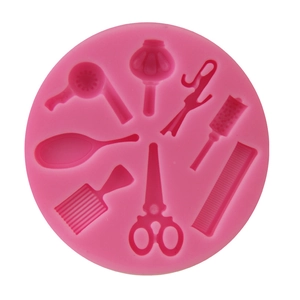 Pink silicone mold featuring salon hair tools like scissors and blow dryer for cake decor