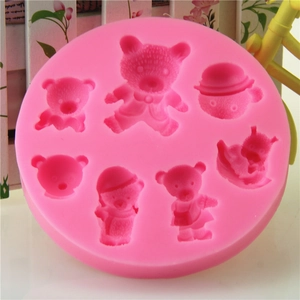 Pink silicone mold featuring 7 cute Christmas bear shapes for fondant and chocolate DIY