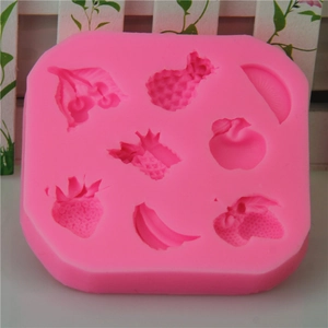 Pink silicone fruit mold with strawberry banana apple shapes for fondant cake decorating