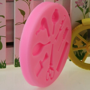 Pink round silicone mold featuring hair salon tools like combs and scissors for cakes