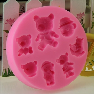 Pink silicone mold featuring multiple small bear shapes for fondant and cake decorating