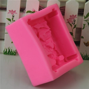 Pink silicone mold for handmade soap featuring a natural rock crystal texture design
