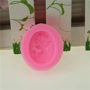 Pink silicone mold featuring an oval relief of a lady cameo for fondant and soap making