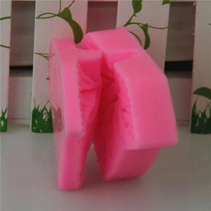Leaf shaped pink silicone mold for DIY cake decorating and baking crafts with textured leaf details