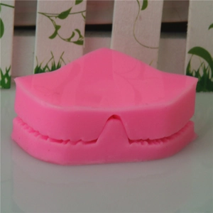 Pink silicone leaf mold with alignment slots for DIY fondant and cake decorating