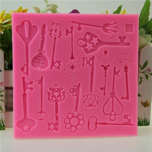 Macro detail of pink silicone steampunk key mold for cake decorating and DIY crafts