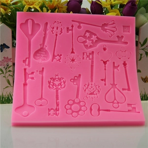 Pink silicone steampunk key mold for fondant and chocolate cake border decoration