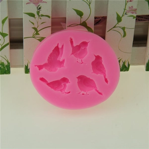 Pink silicone bird mold for fondant and chocolate cake decorating with five bird designs