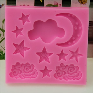 Pink silicone mold with moon stars and clouds for fondant and chocolate cake decoration