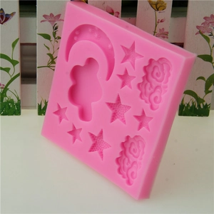 Pink silicone mold featuring star, moon and cloud shapes for cake and chocolate decorating