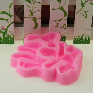 Detailed macro view of pink silicone rabbit mold for fondant and chocolate cake decoration